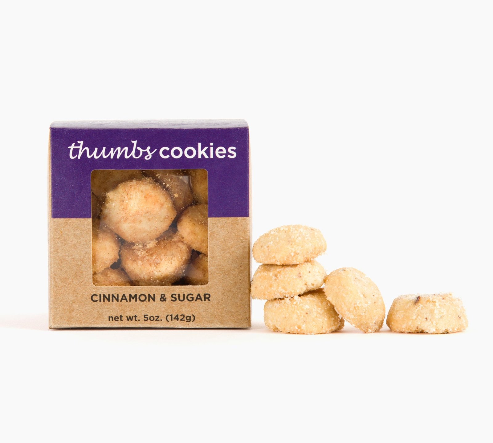 A box labeled "thumbs cookies" with cinnamon & sugar flavor is next to a small stack of round cookies. The net weight is 5 oz (142g). 